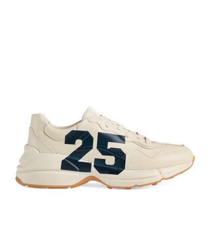 The Gucci Eschatology Rhyton leather sneaker with "Gucci Eschatology 1921" and "25" script.