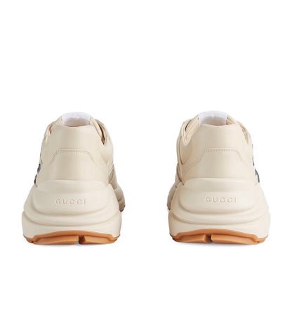 The Gucci Eschatology Rhyton leather sneaker with "Gucci Eschatology 1921" and "25" script.