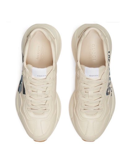The Gucci Eschatology Rhyton leather sneaker with "Gucci Eschatology 1921" and "25" script.