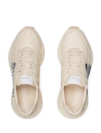 The Gucci Eschatology Rhyton leather sneaker with "Gucci Eschatology 1921" and "25" script.